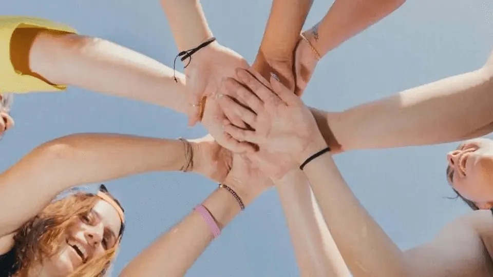 Hands stacked in a circle