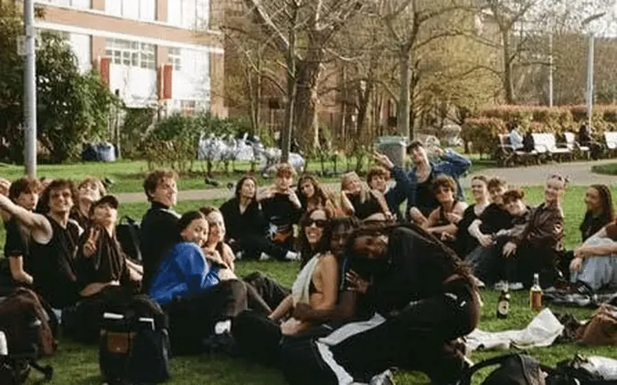 Students gathered on a campus lawn